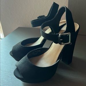 Black high heels.